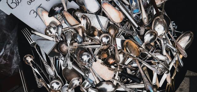 silver and gold motorcycle engine by Mika Baumeister courtesy of Unsplash.